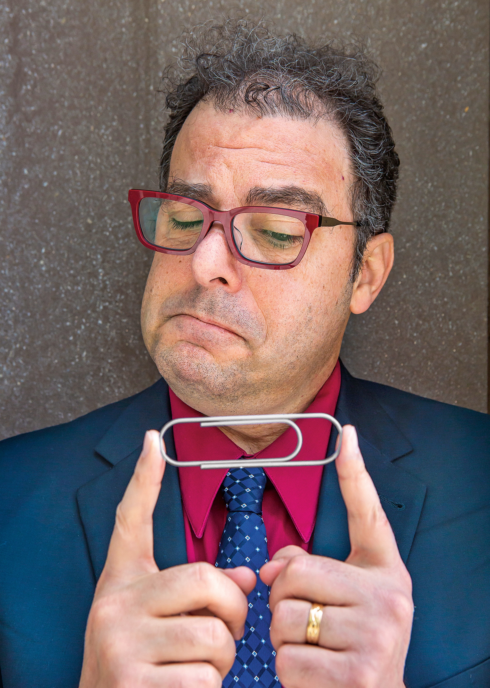 photo of Michael Littman considering a paperclip